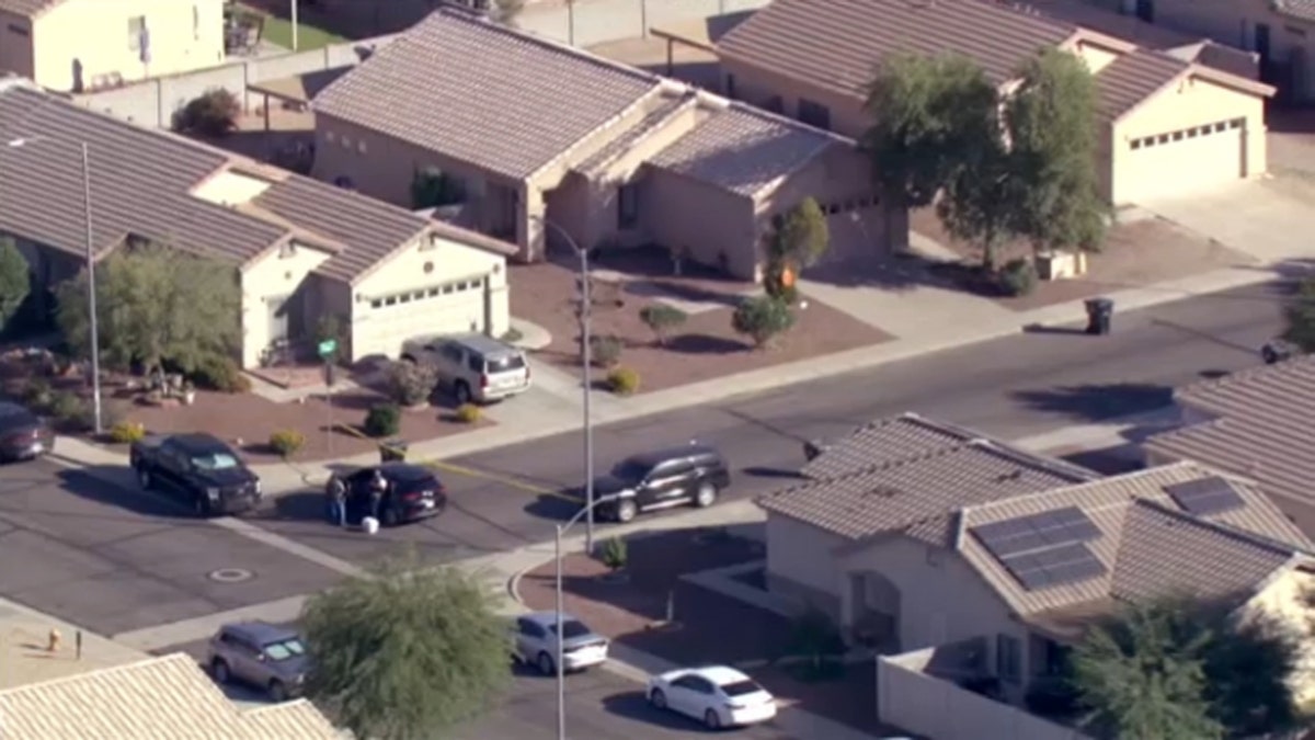 Federal agents surround a home in Avondale