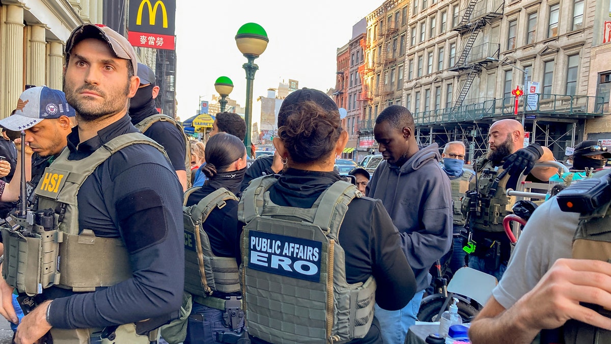 Federal officers in Chinatown, New York during a sweep on Canal Street