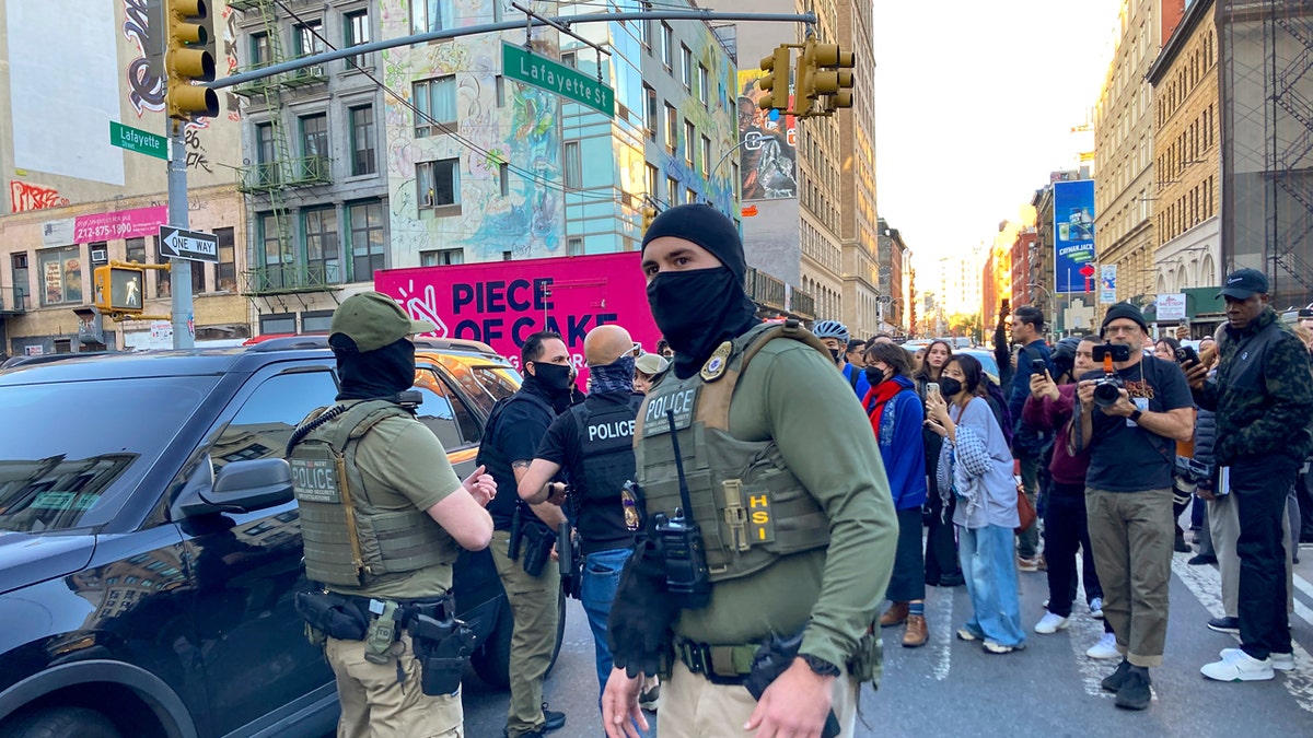 Federal agents in Chinatown during a sweep on Canal Street in New York