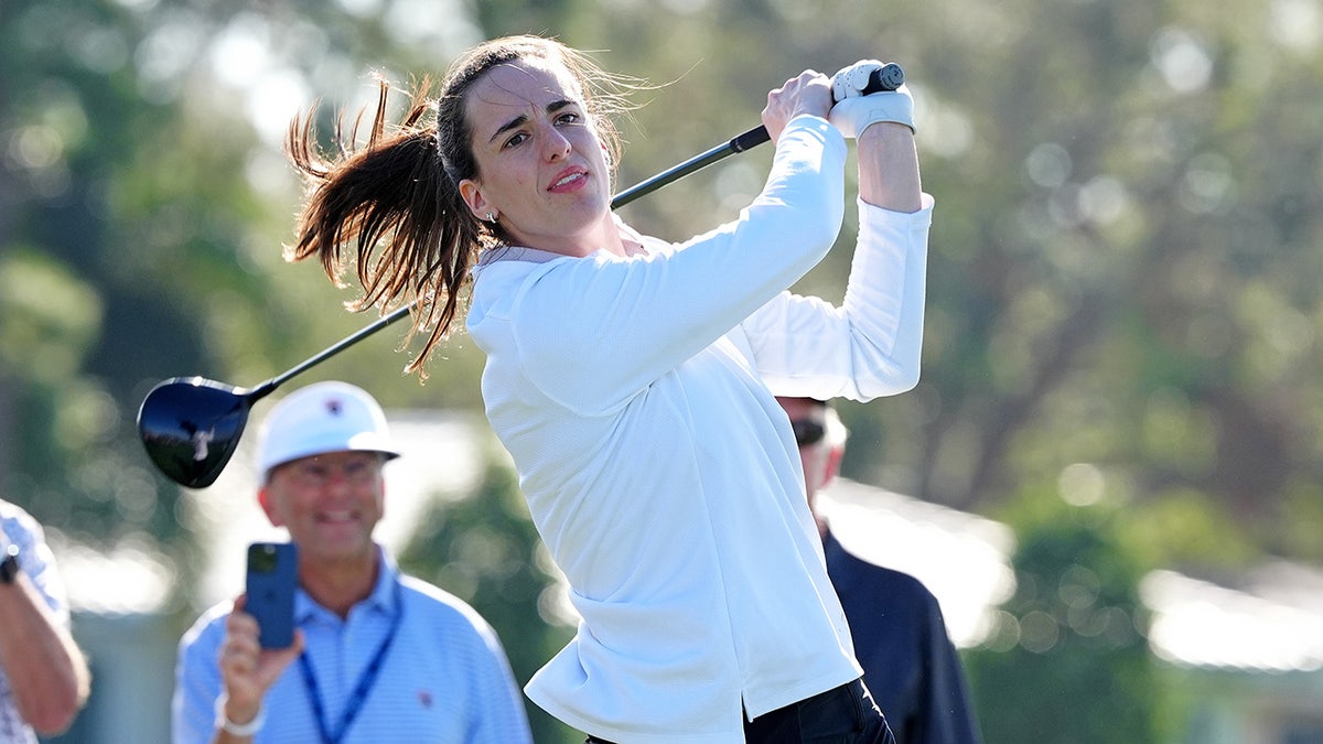 Caitlin Clark plays a tee shot