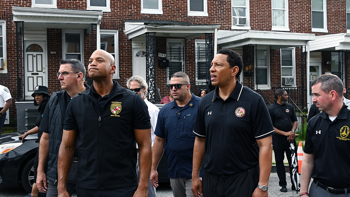Gov. Wes Moore and Ivan Bates, State's Attorney for Baltimore City, survey houses in the city