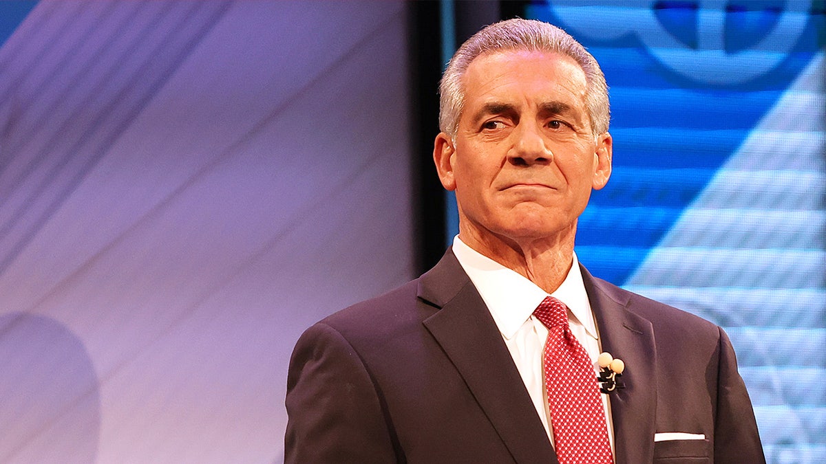 Jack Ciattarelli stands at a podium on stage