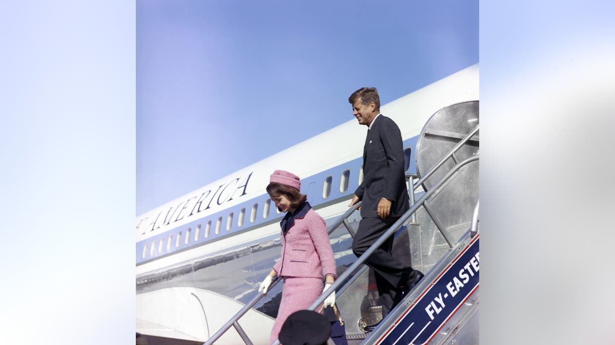 President John F. Kennedy and First Lady Jacqueline Kennedy descend the stairs from Air Force One at Love Field in Dallas, Texas, on November 22, 1963.