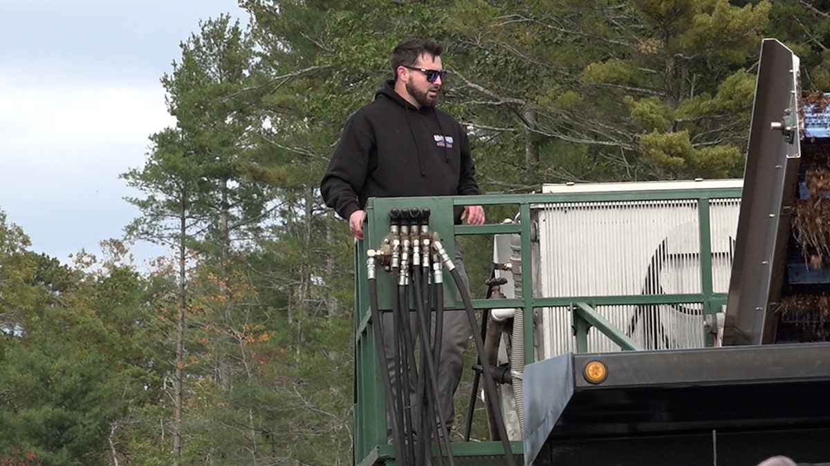 Cranberry farmer overseeing harvest