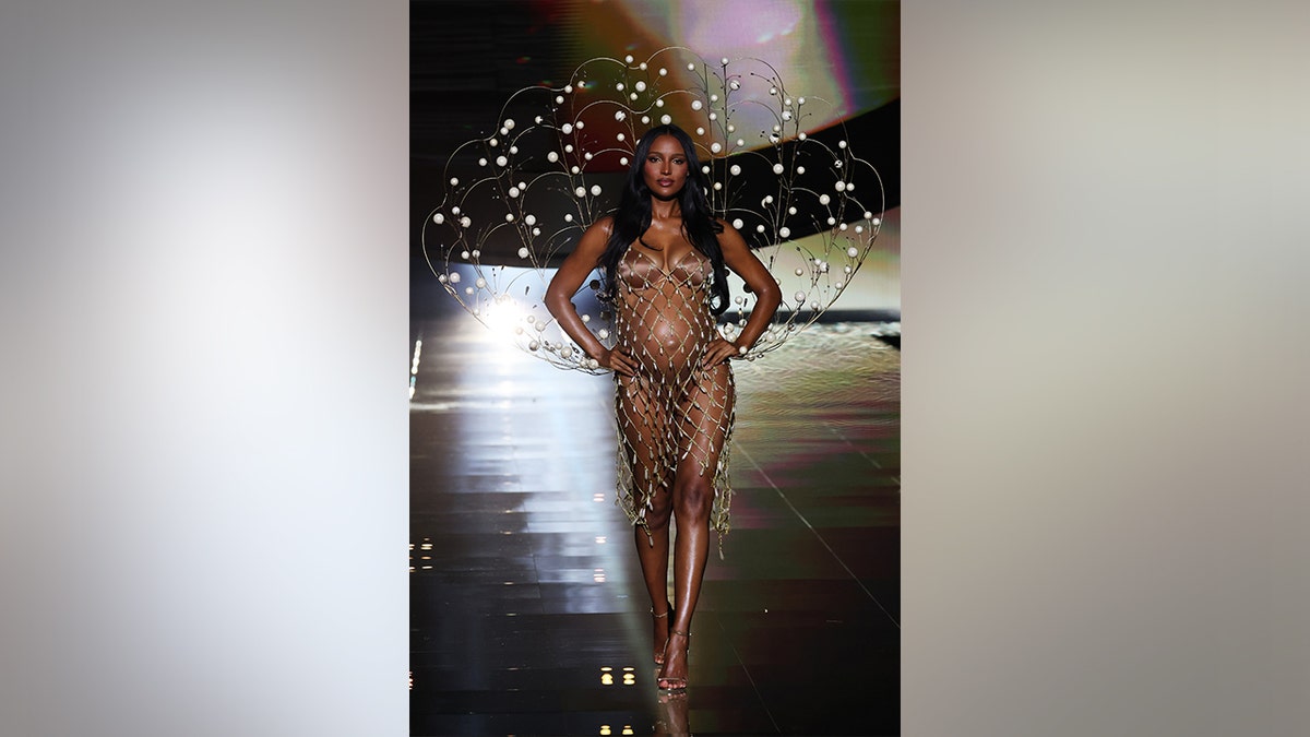 Jasmine Tookes opened the Victoria's Secret Fashion Show, showing off her pregnant belly in a brown lingerie set.