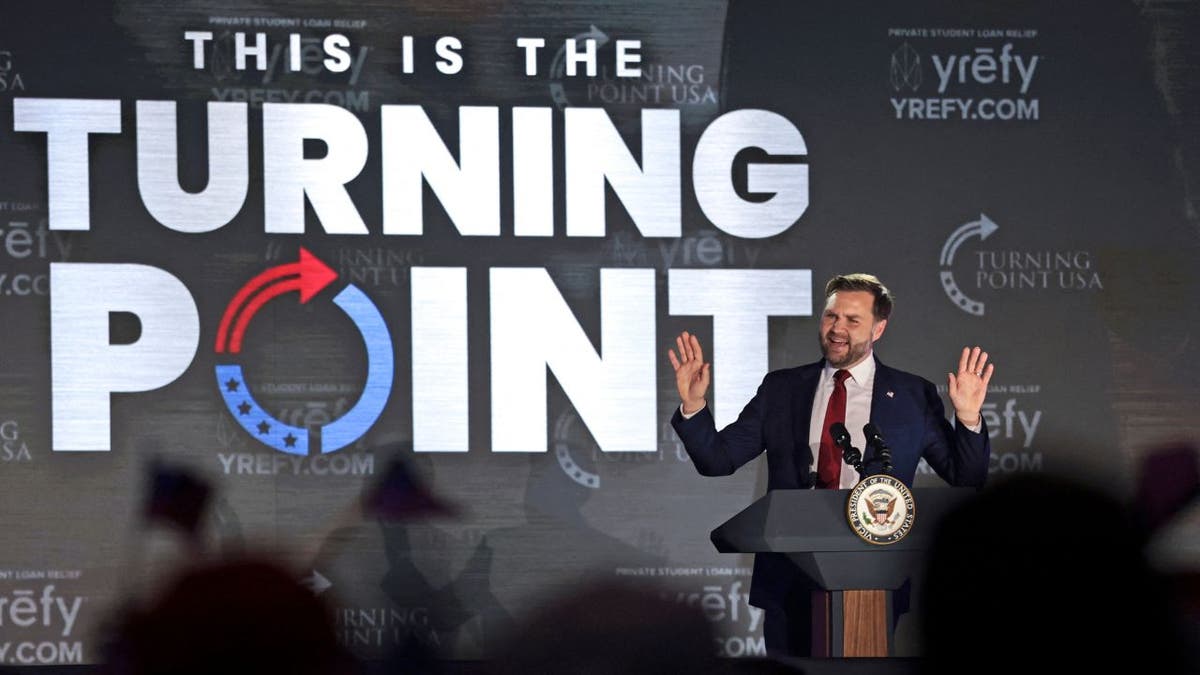 Vice President JD Vance speaking at a Turning Point USA event at the University of Mississippi on podium.