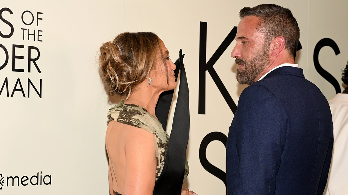 Ben Affleck and Jennifer Lopez chatting while on the red carpet at the premiere of "Kiss of a Spider Woman" in October 2025.
