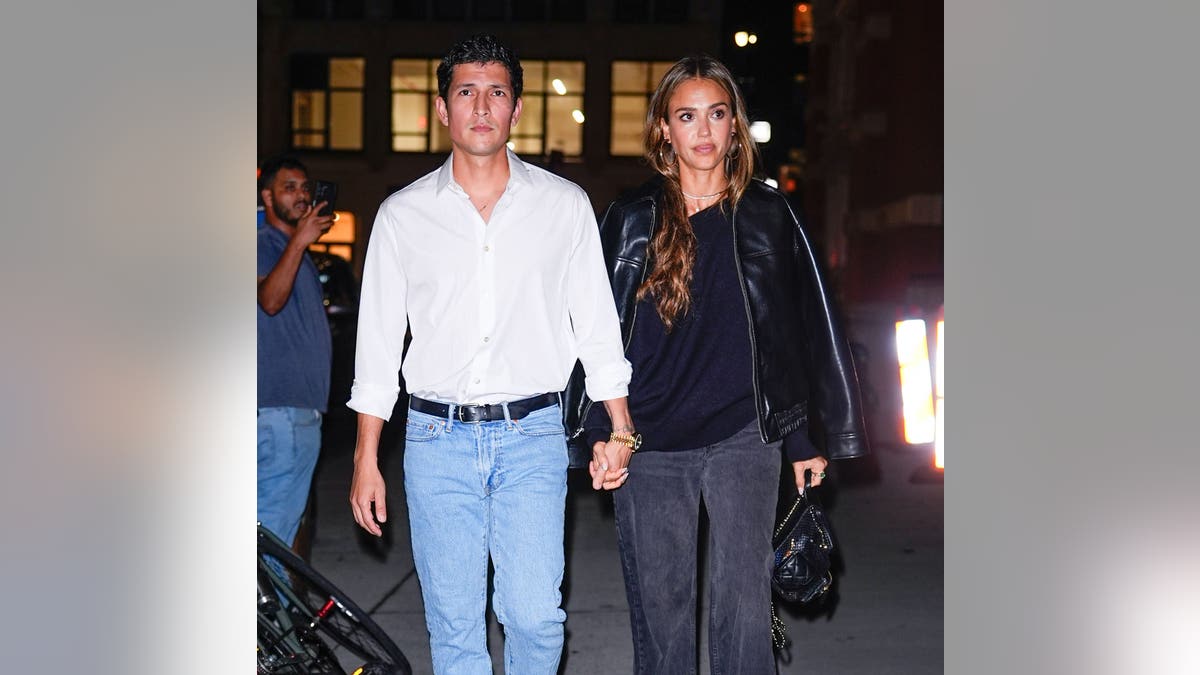 Jessica Alba and Danny Ramirez hold hands while walking together in New York City on September 17, 2025.