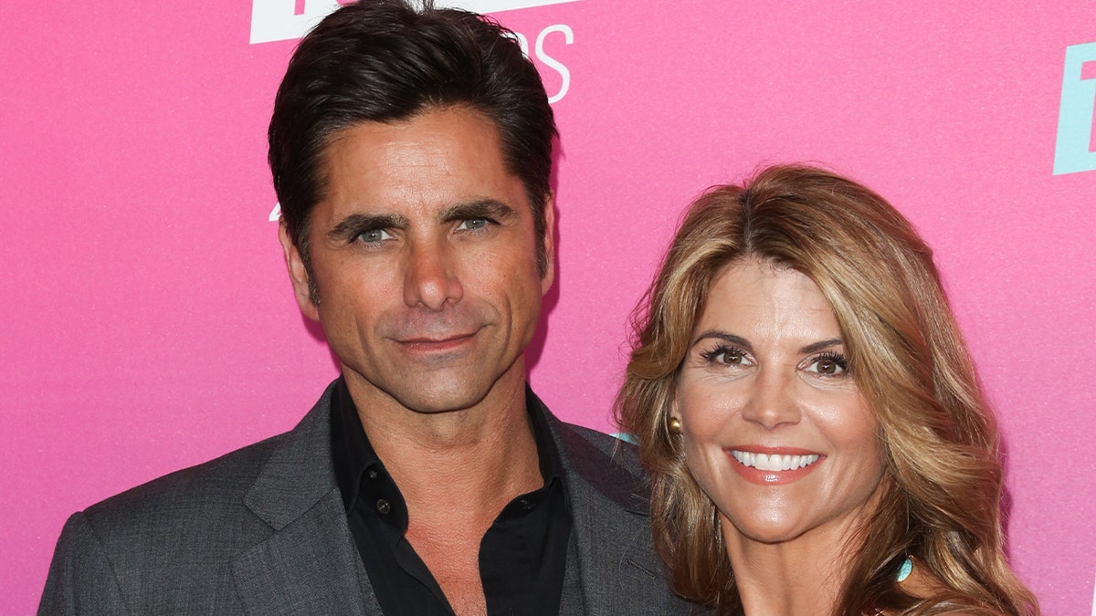 John Stamos wears grey blazer with Lori Loughlin on red carpet