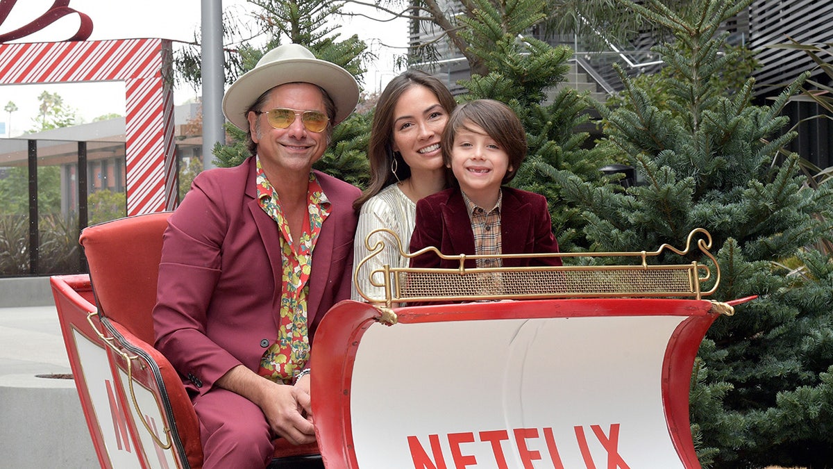 John Stamos with wife and son at a Christmas event