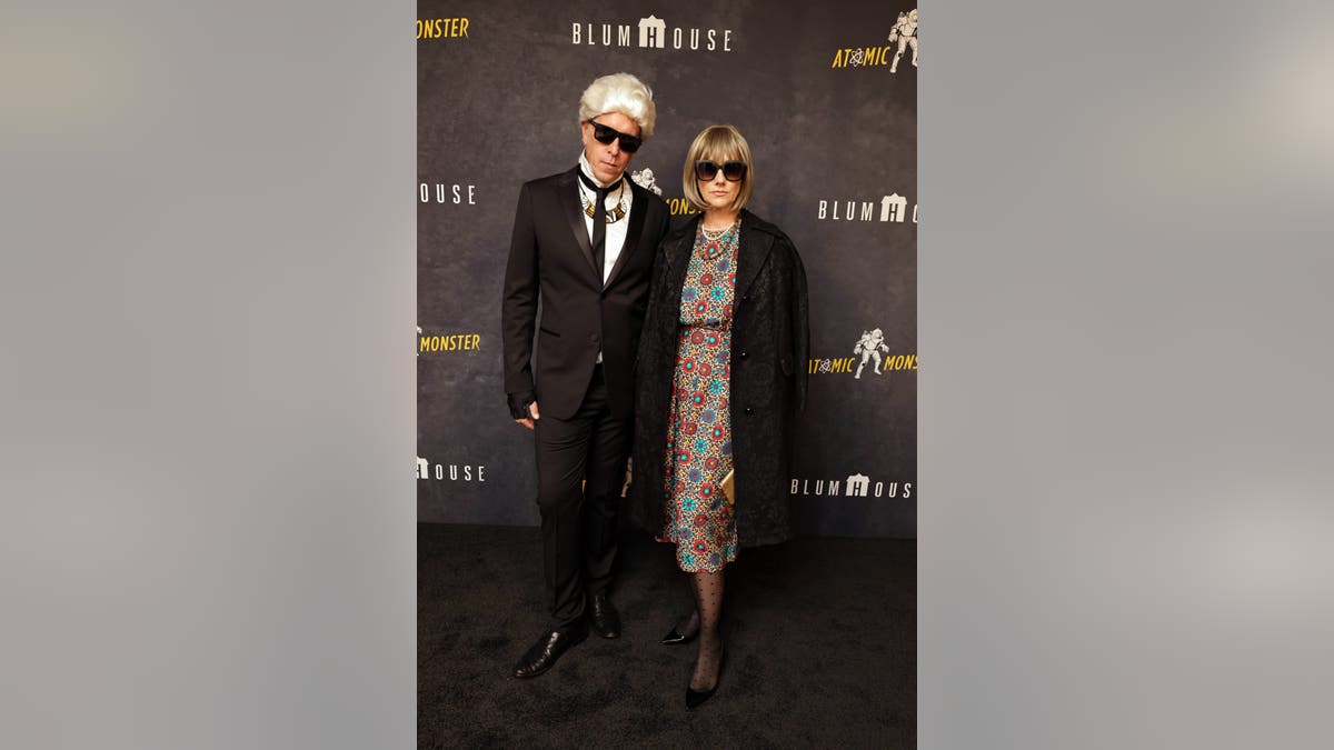 Judy Greer and Dean Johnsen dressed in Halloween costumes at the Blumhouse and Atomic Monster party in Los Angeles