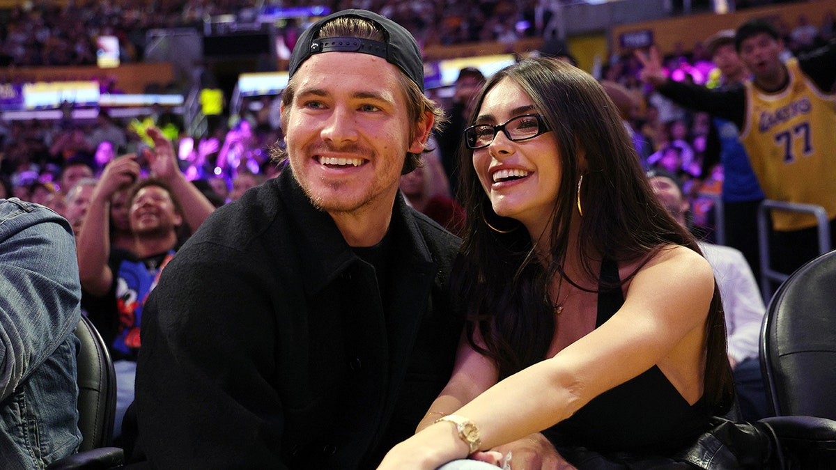 Justin Herbert and Madison Beer courtside at an NBA game