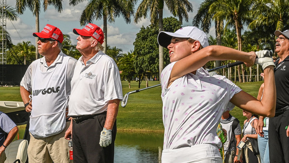Trump watching Kai's tee shot