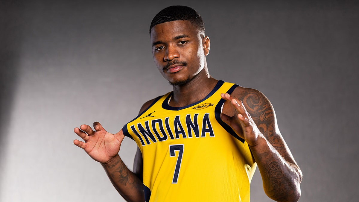 Kam Jones poses for media day