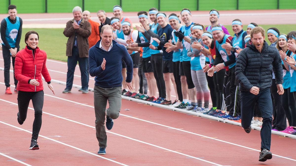 Kate Middleton runs alongside Prince William and Prince Harry