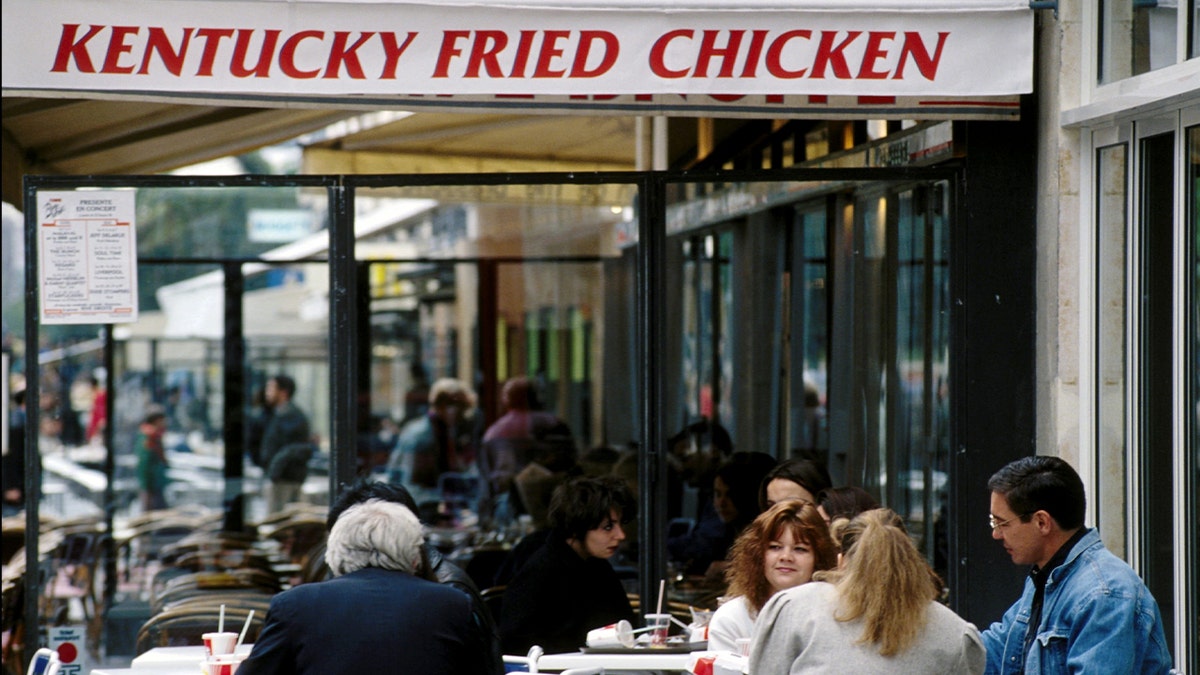 People eating at KFC restaurant in 1990s