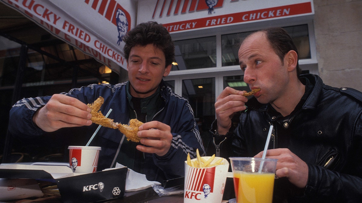 People eating at KFC restaurant in 1990s