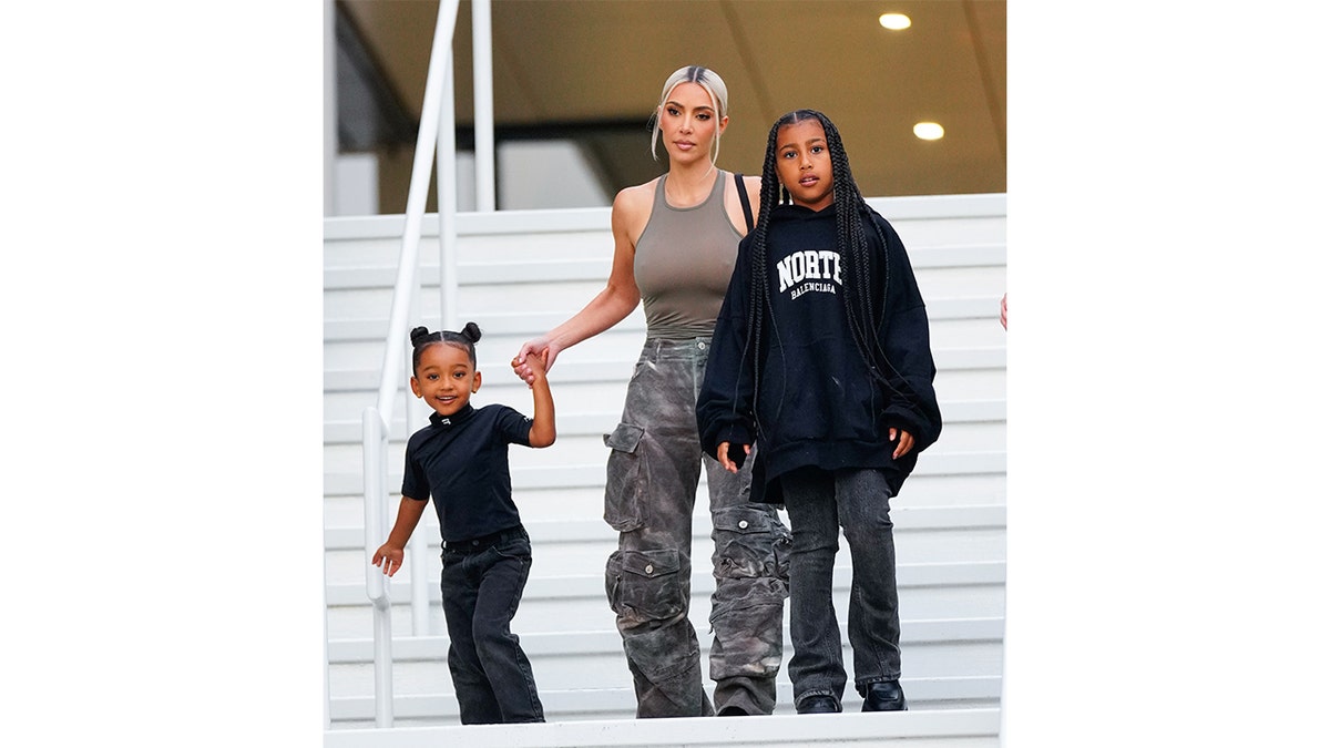 Kim Kardashian holds hands with Chicago and walks with North