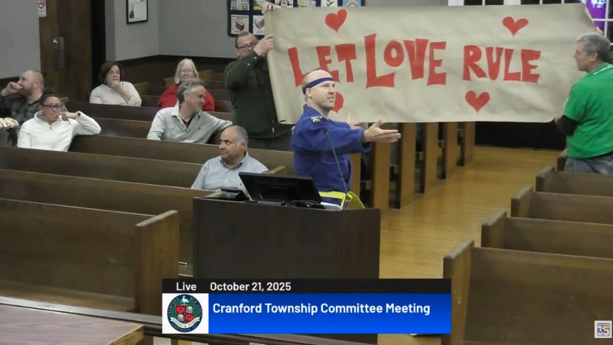 kung-fu-let-love-rule-1 Cranford candidate Will Thiele Kung Fu kicks through protest signs