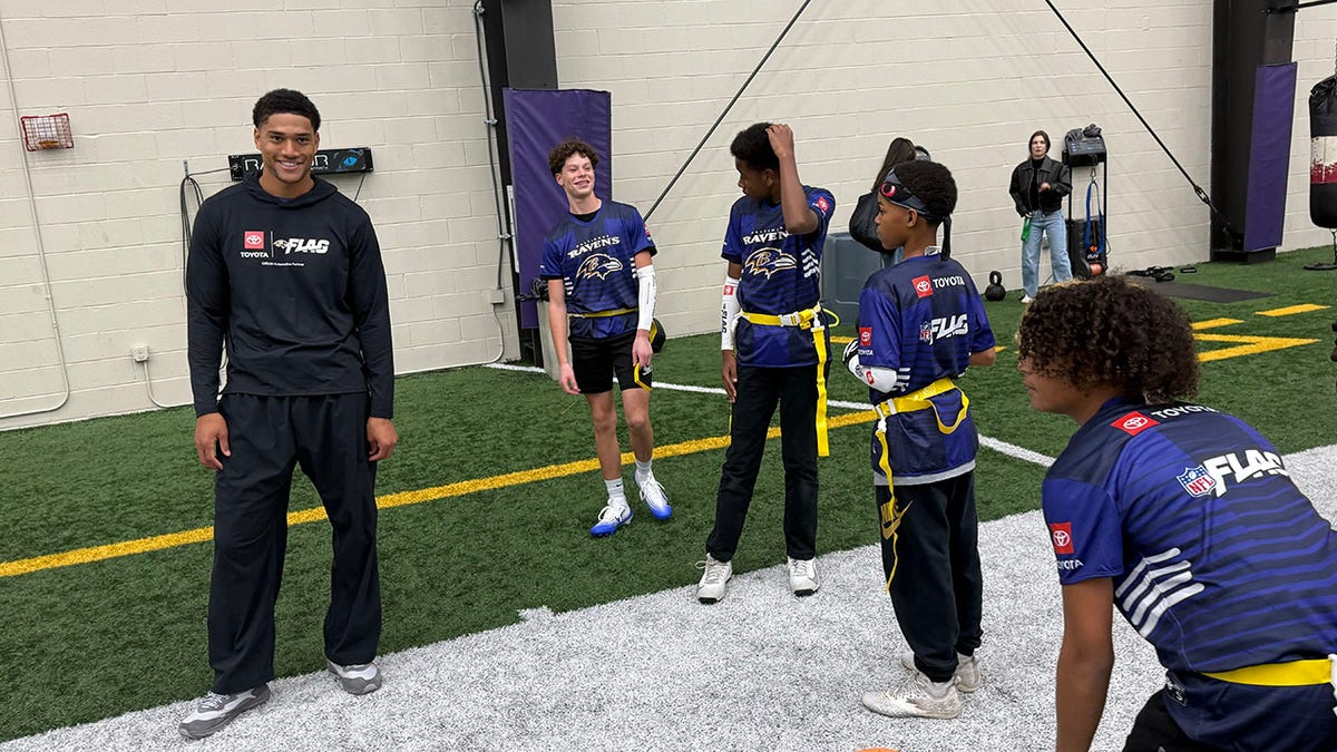 Kyle Hamilton participates in flag football event with kids