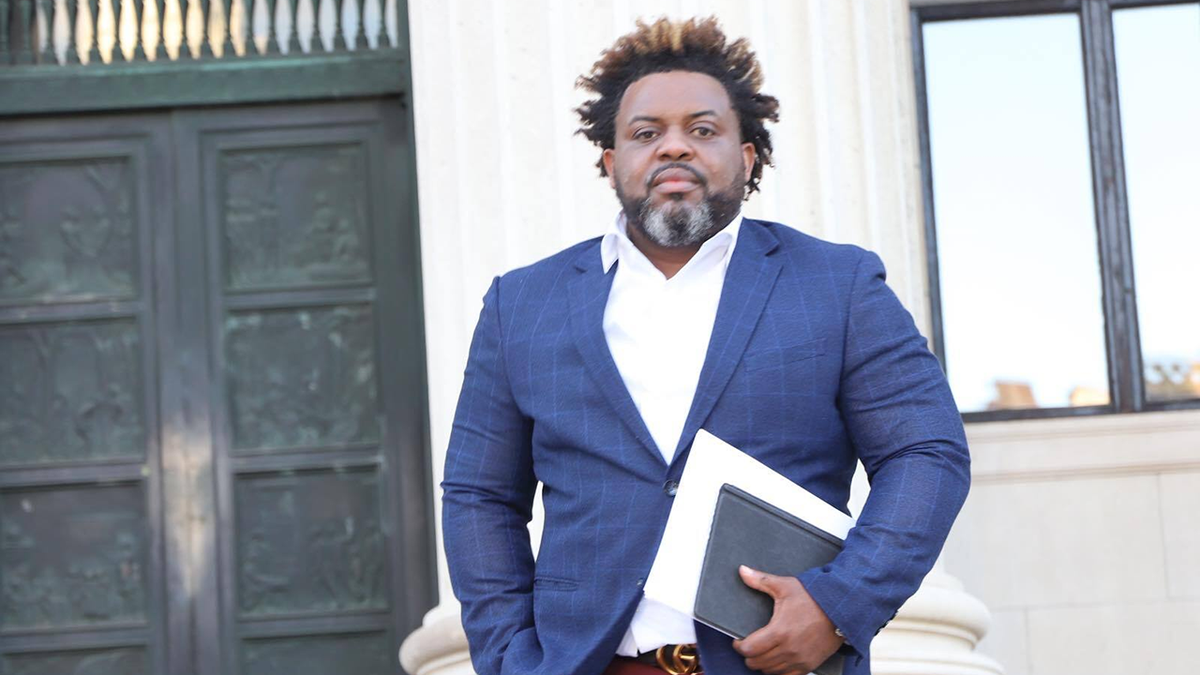 LaMar Cook standing outside a building.