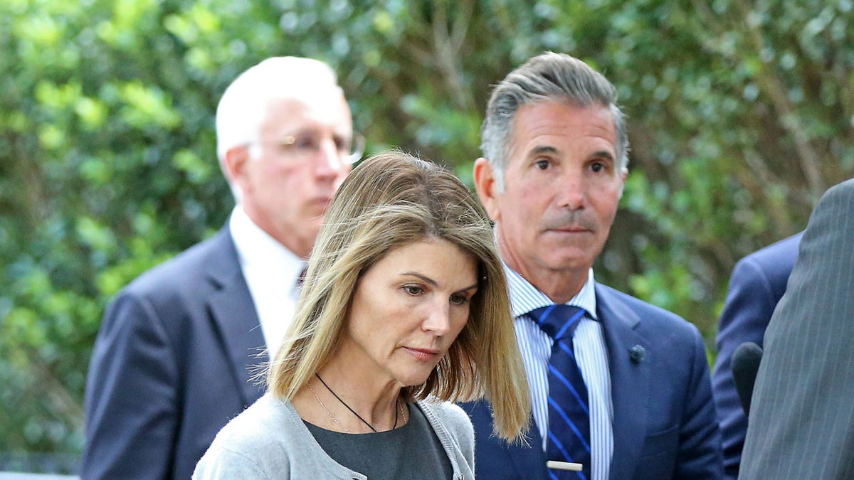 Lori Loughlin and Mossimo Giannulli outside a courthouse