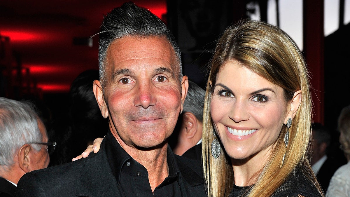 Lori Loughlin and Mossimo Giannulli posing together