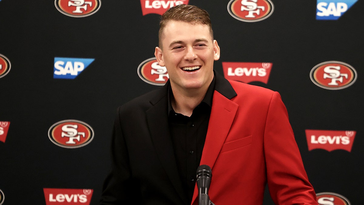 Mac Jones speaks to the media