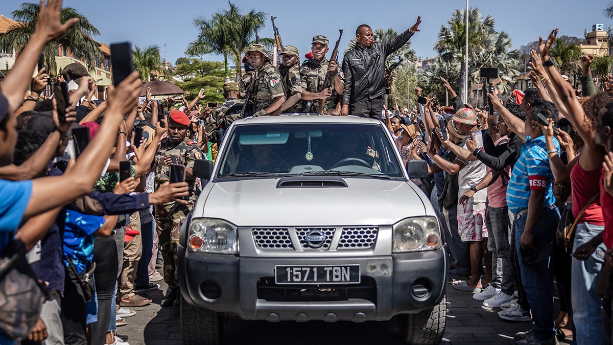 Members of Madagascar's CAPSAT military unit surrounded by crowds