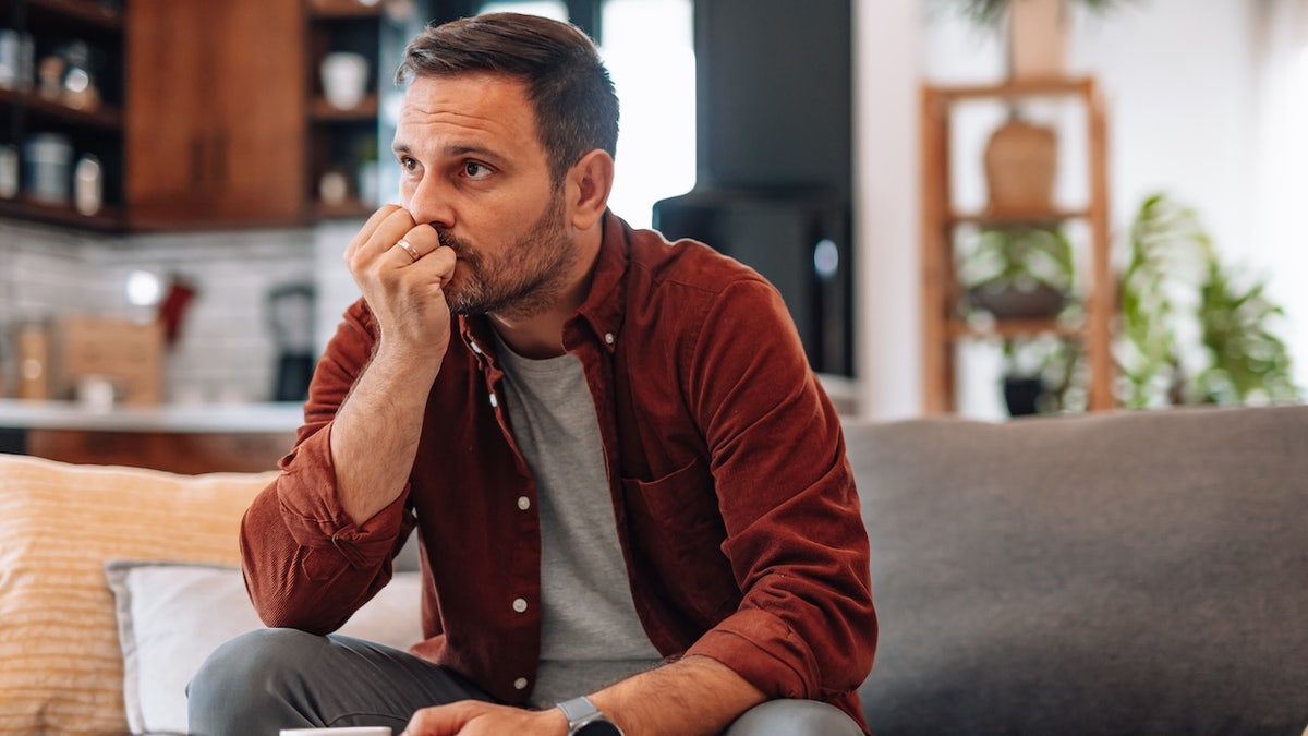 Man sitting on couch