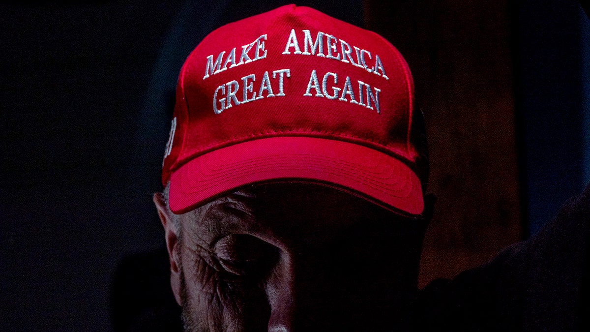 A man wearing a "Make America Great Again" hat