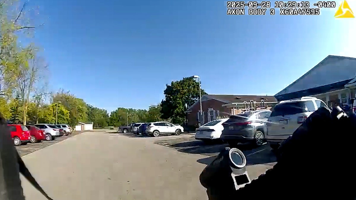Michigan police body camera video shows response to shooting.