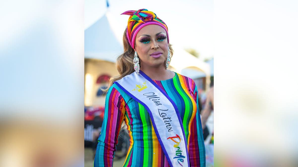 Aubrey Ghalichi wearing a rainbow dress and headscarf at Phoenix Pride Festival 2021.