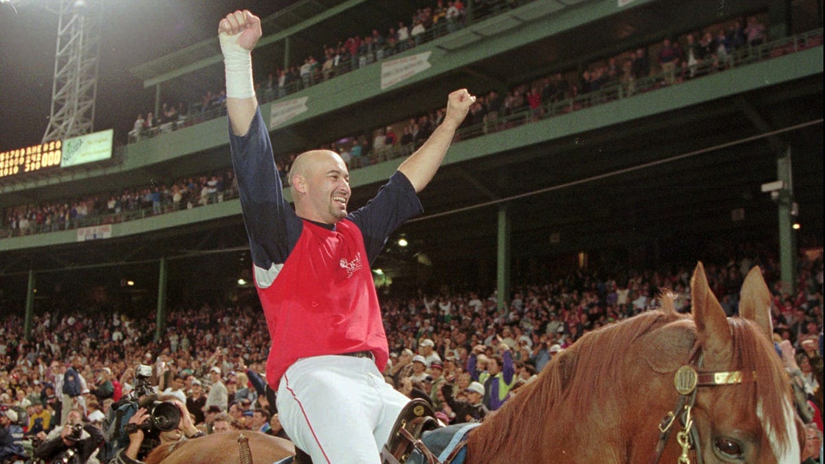 Mike Greenwell rides a horse in Fenway Park