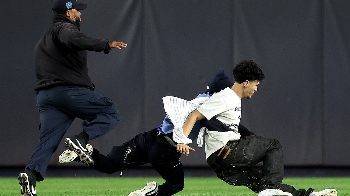 Security tackles a fan