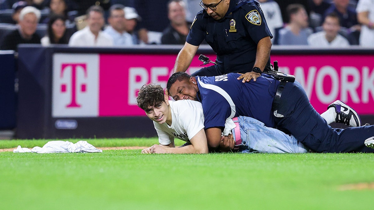 Fan on the ground after being tackled