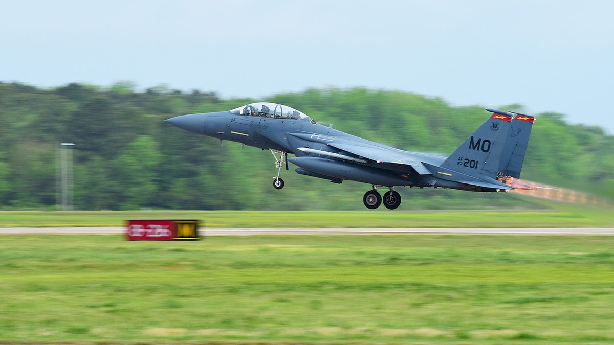 a fighter plane takes off from an air base