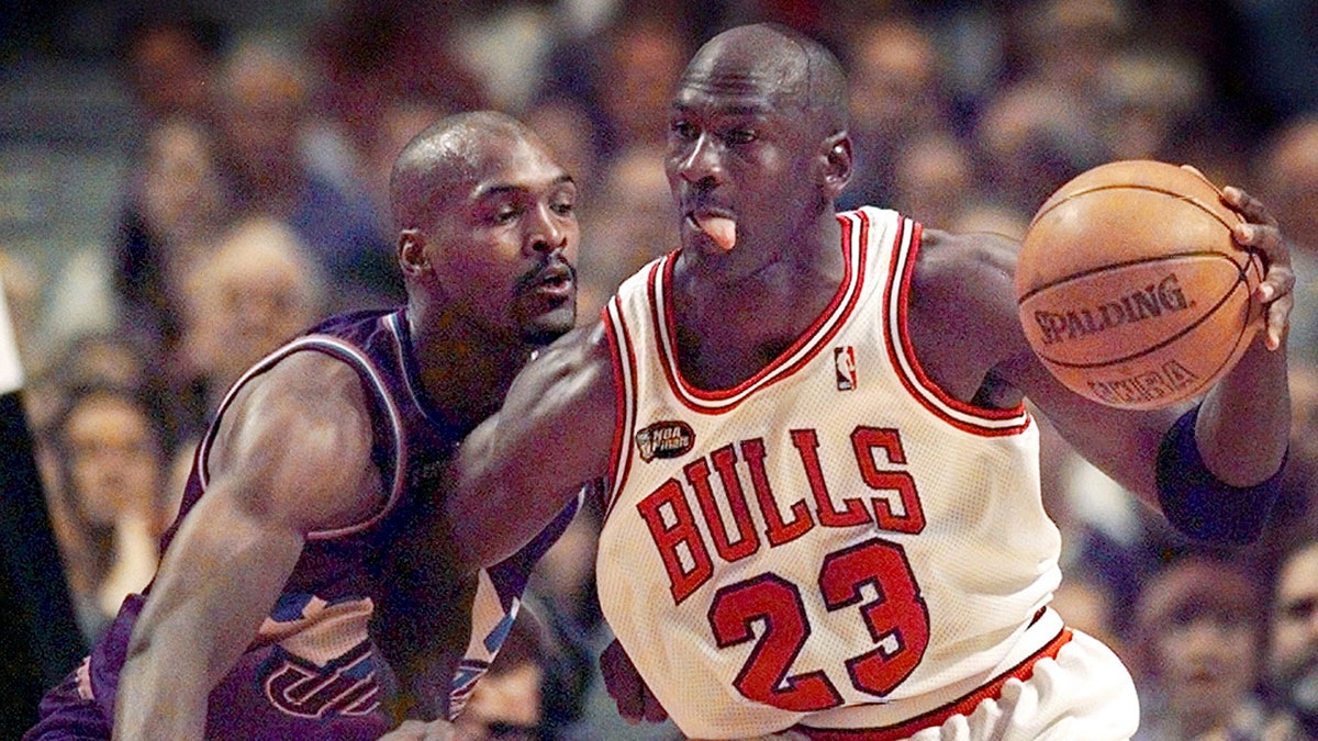 Michael Jordan backs down Bryon Russell