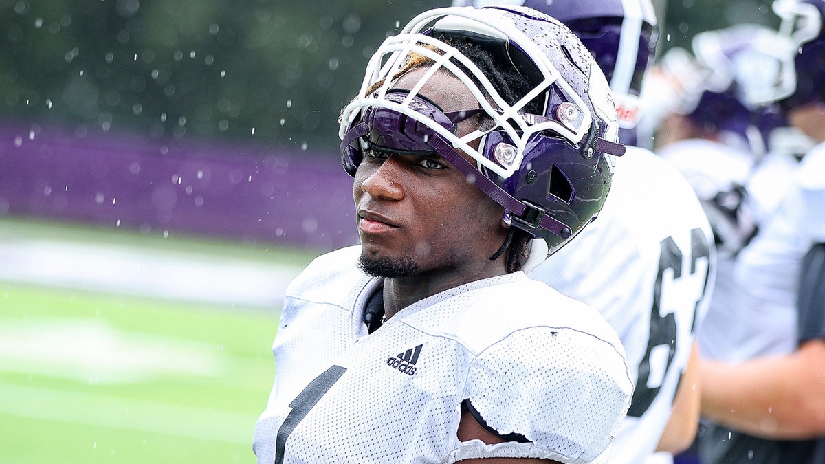 Montie Quinn with his helmet over his forehead