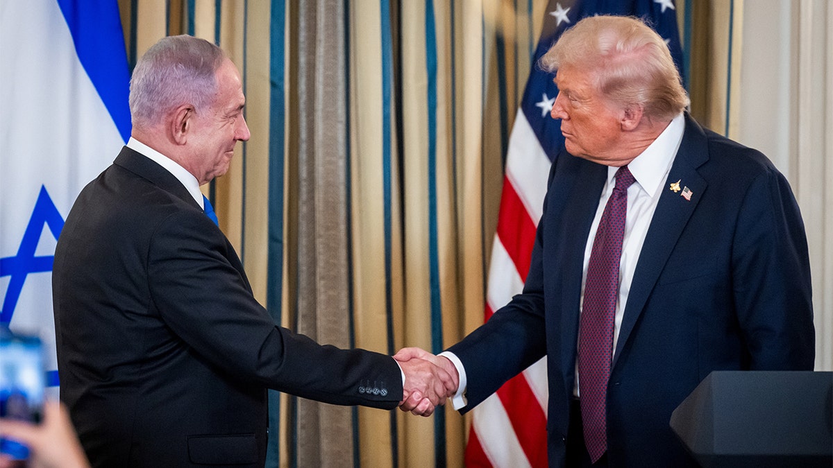 Netanyahu and Trump shake hands