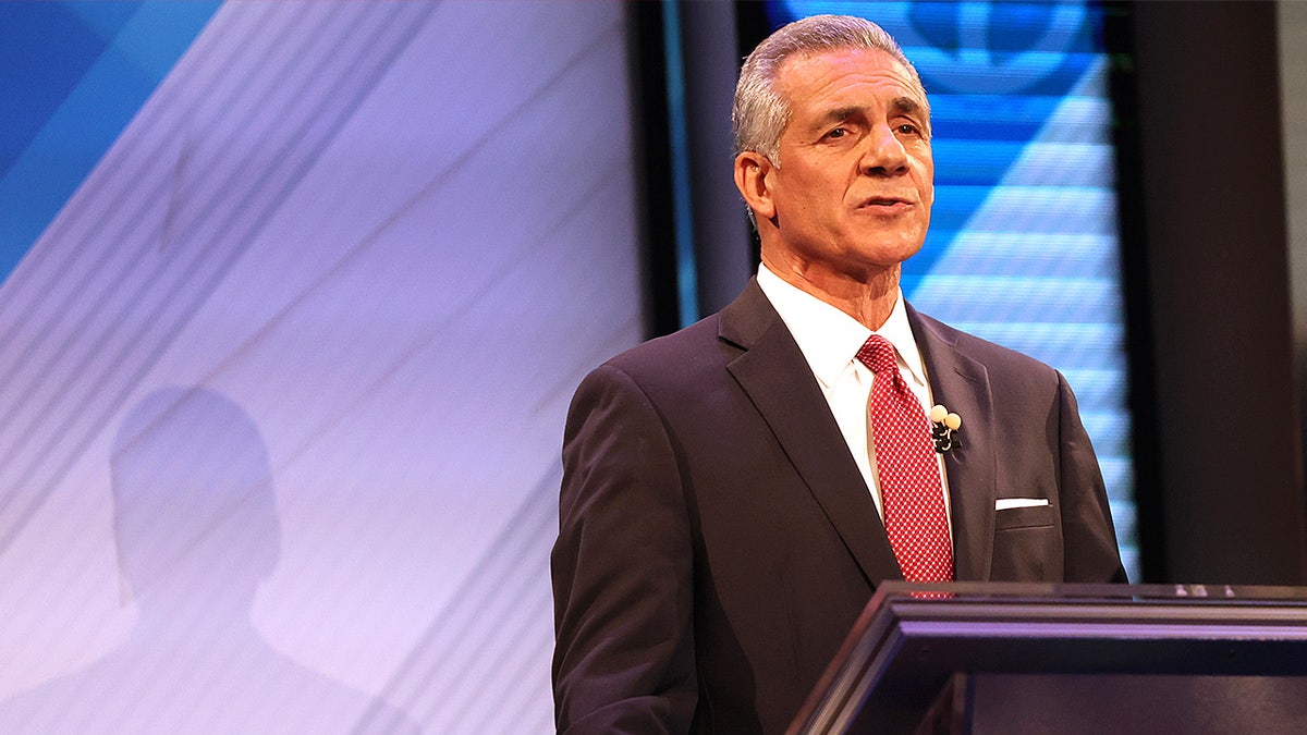 Jack Ciattarelli stands at a podium on stage