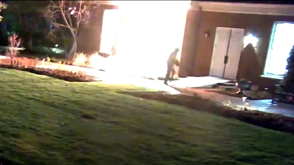 Cody Balmer walks away after throwing a Molotov cocktail into Gov. Shapiro's mansion