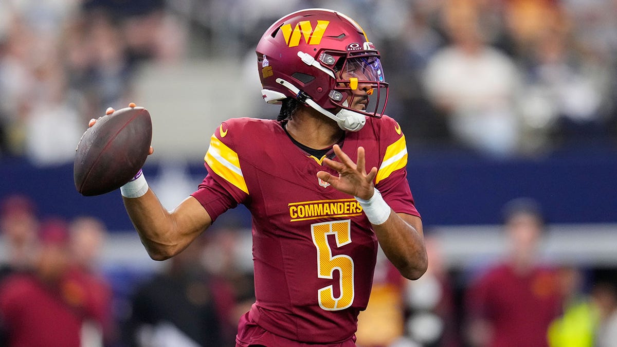 Jayden Daniels drops back to pass