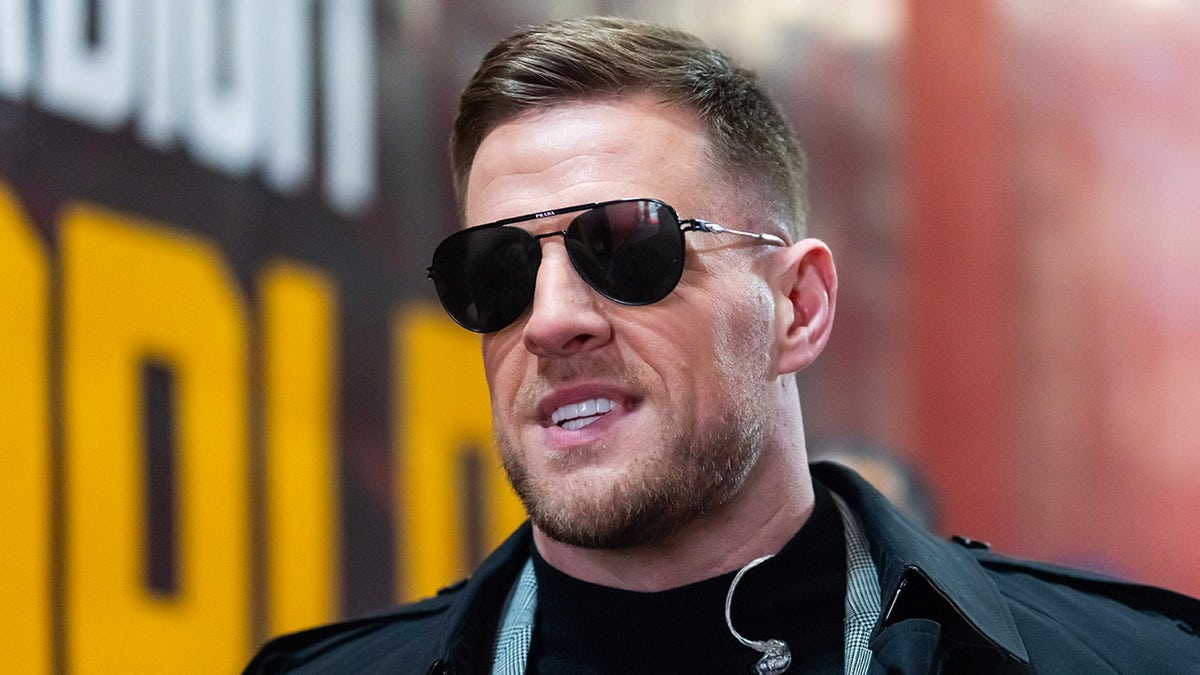 JJ Watt arrives for a playoff game