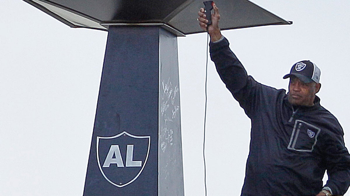 George Atkinson lights the Al Davis flame