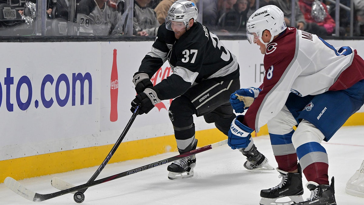 Warren Foegele goes for the puck