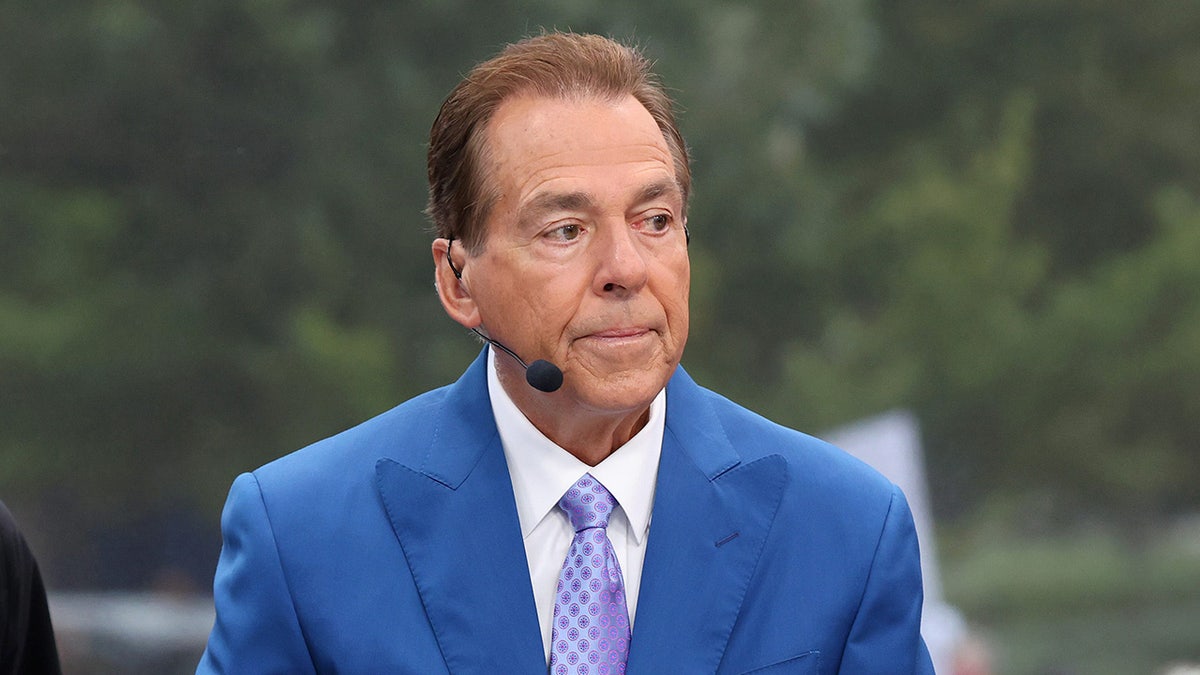 Nick Saban looks on