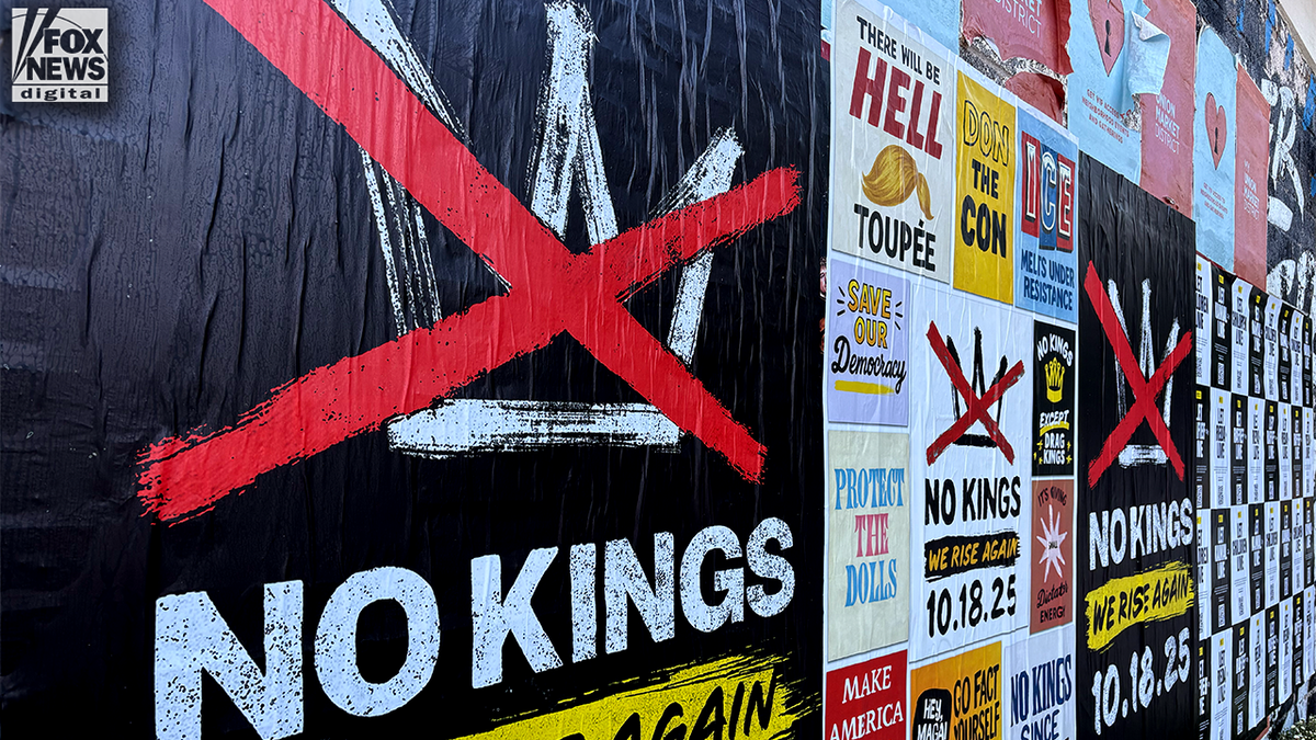 No Kings Day and protest signs cover the wall at Union Market in DC