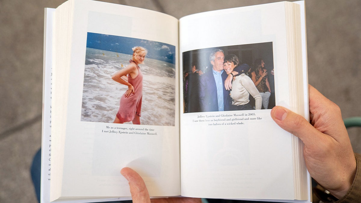 A person holds open pages of the book "Nobody's Girl - A Memoir of Surviving Abuse and Fighting for Justice" by Virginia Roberts Giuffre