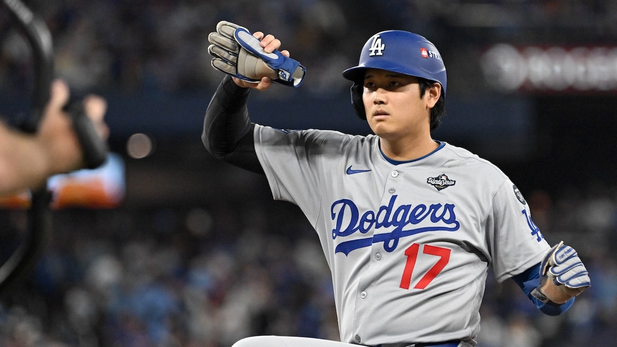 Los Angeles Dodgers designated hitter Shohei Ohtani (17) celebrates after hitting a single against the Toronto Blue Jays in the eighth inning during game two of the 2025 MLB World Series at Rogers Centre.